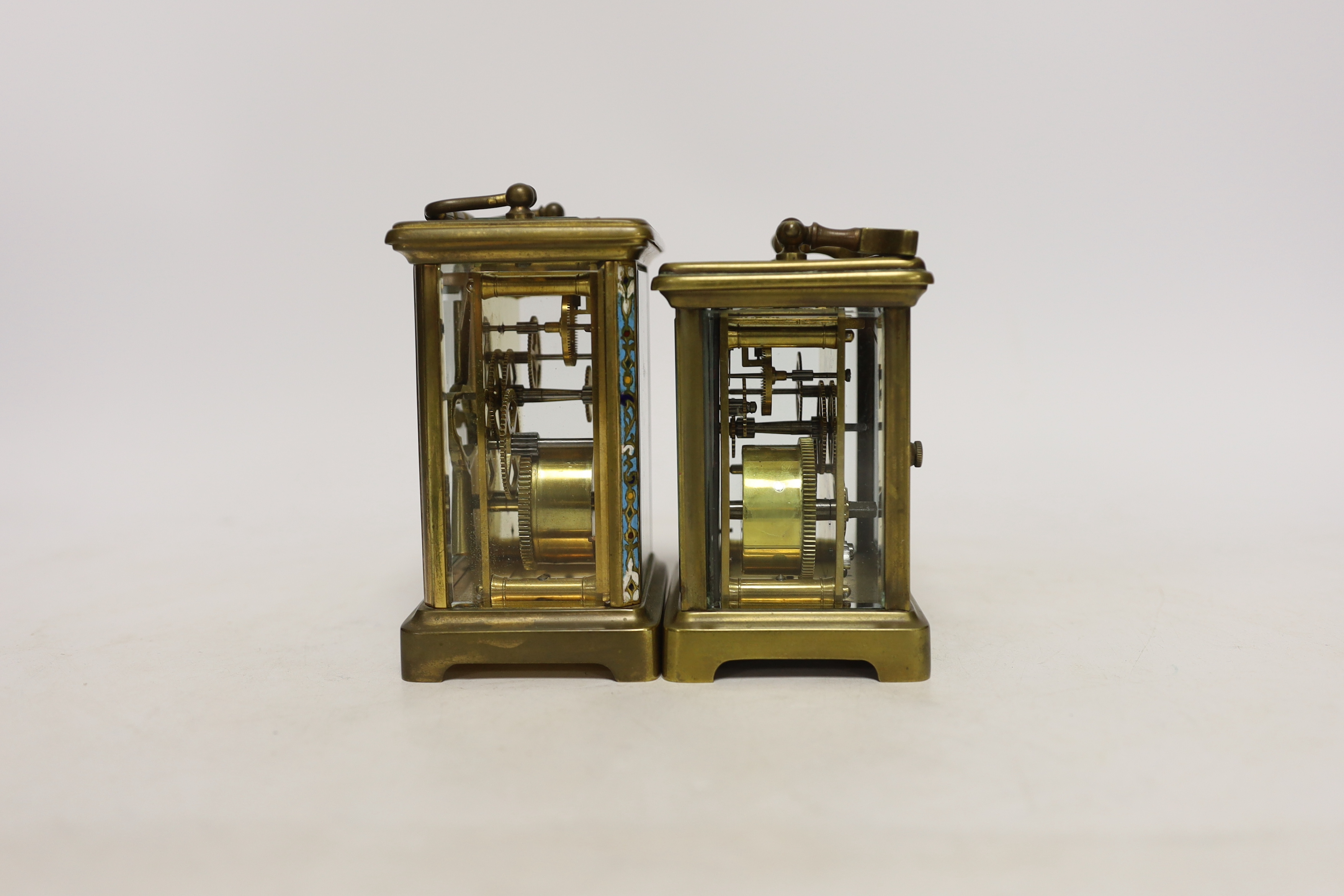 Two brass cased carriage timepieces including a French champleve enamel example with enamel dial, largest 15cm high